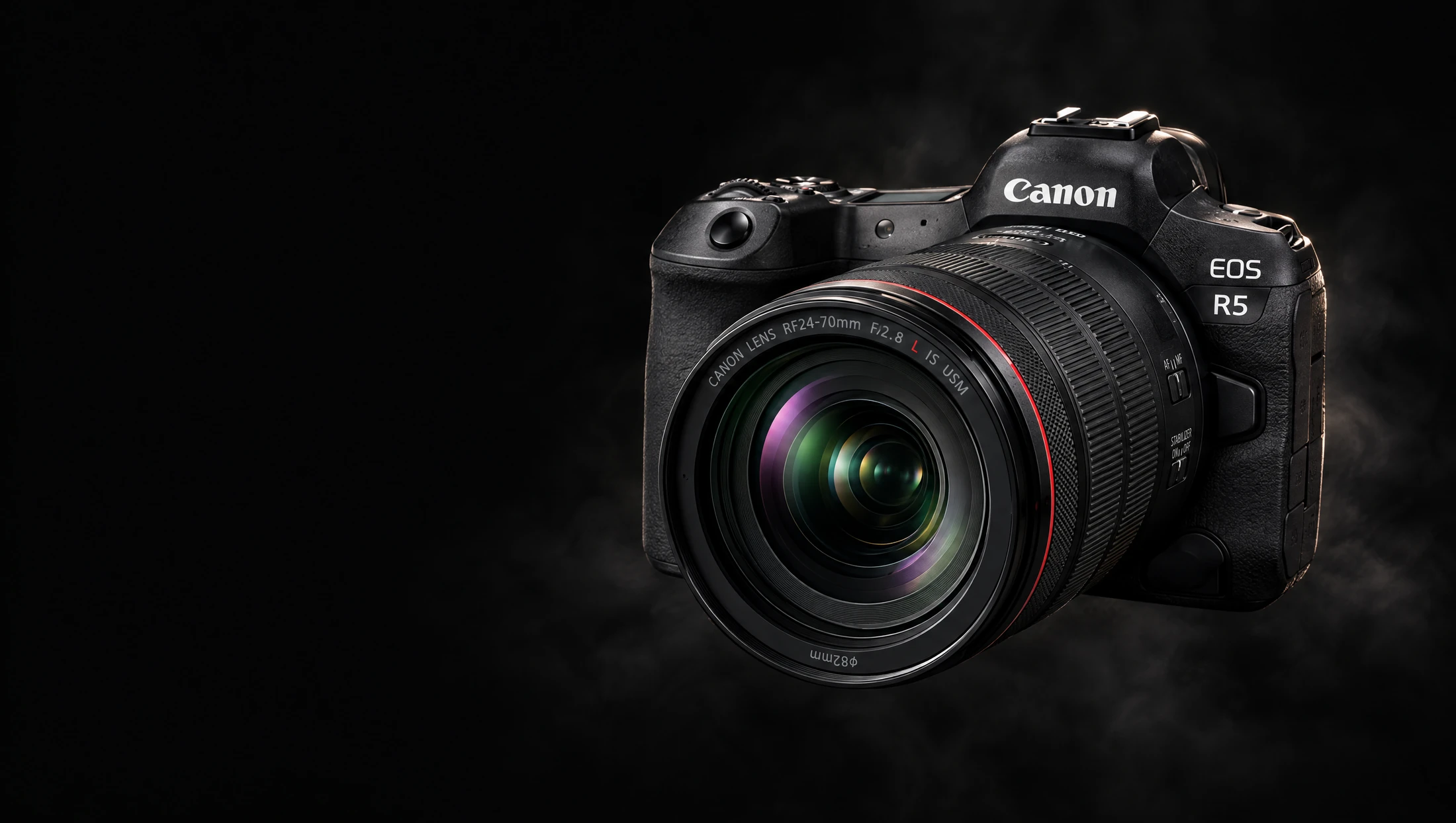 Canon EOS R5 and 24–70mm L lens in a dark, misty studio