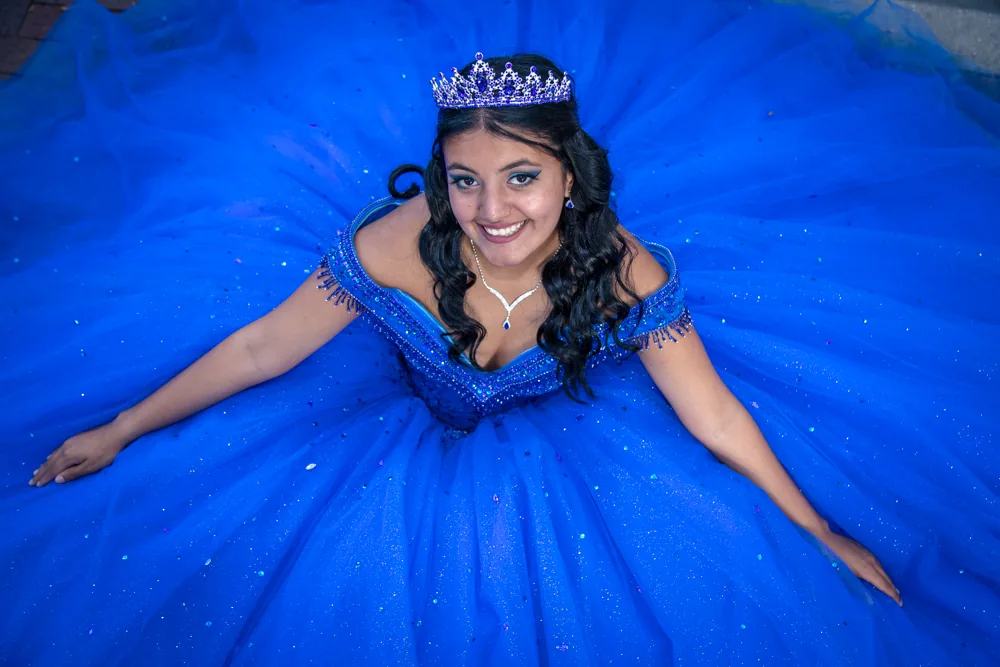 Quinceañera in a royal blue gown and tiara